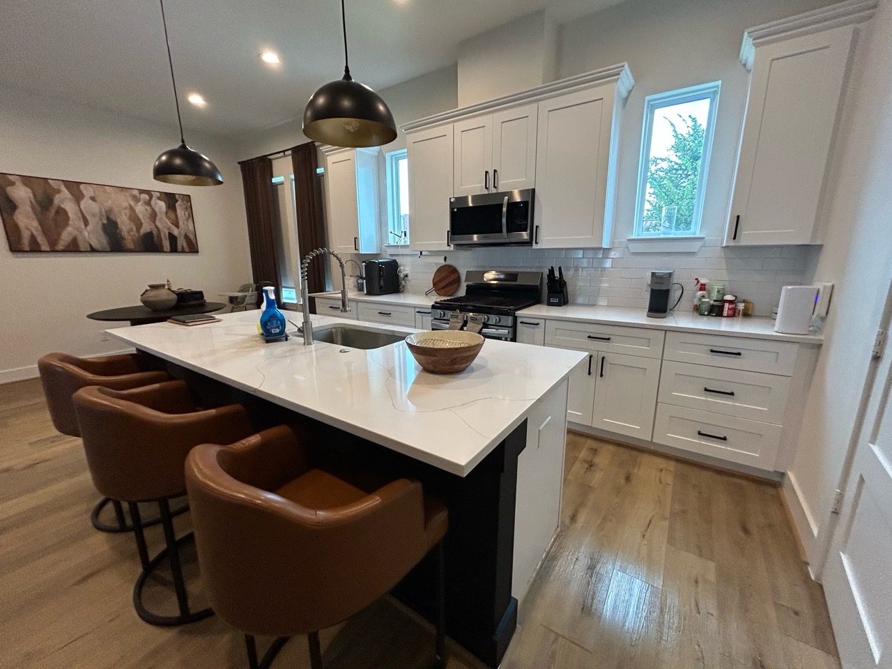 A clean, well-lit Houston kitchen with a marble island